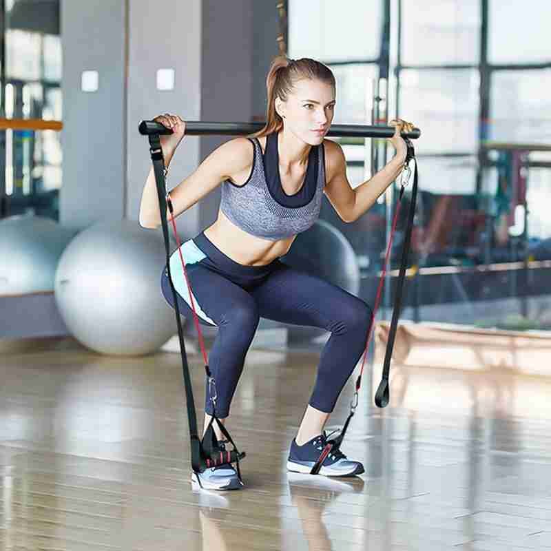 Pilatesstang med strikk og fotstropper