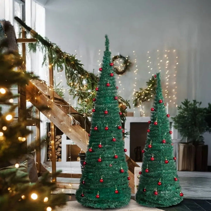 To pop-up-juletrær med røde kuler