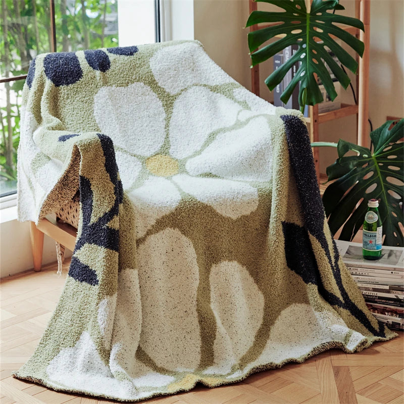Strikket boho-pledd med blader og blomster i mikrofiber