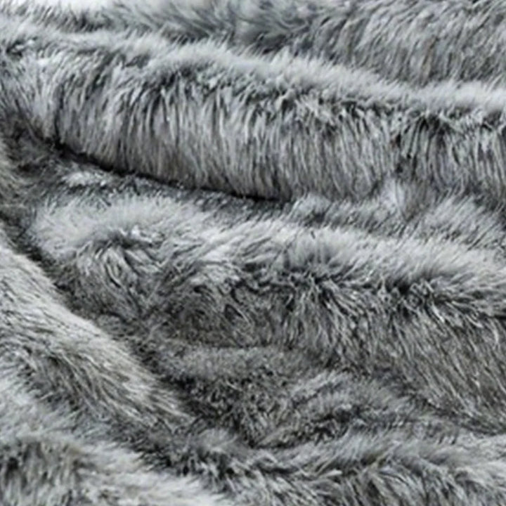 Fluffy pledd i kunstpels med forsterkede kanter
