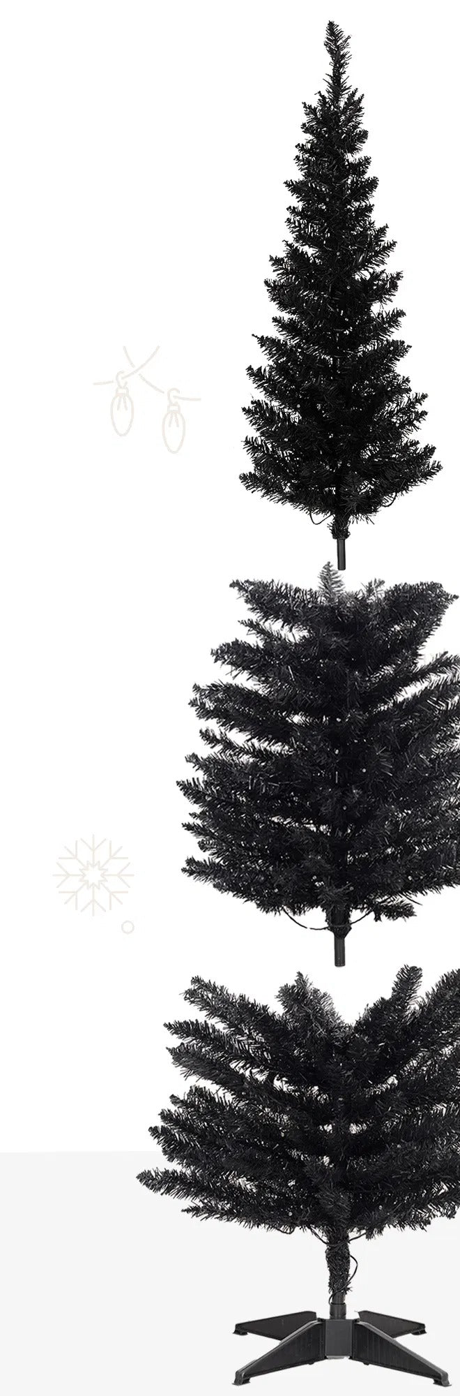 Svart smalt juletre med varme lys