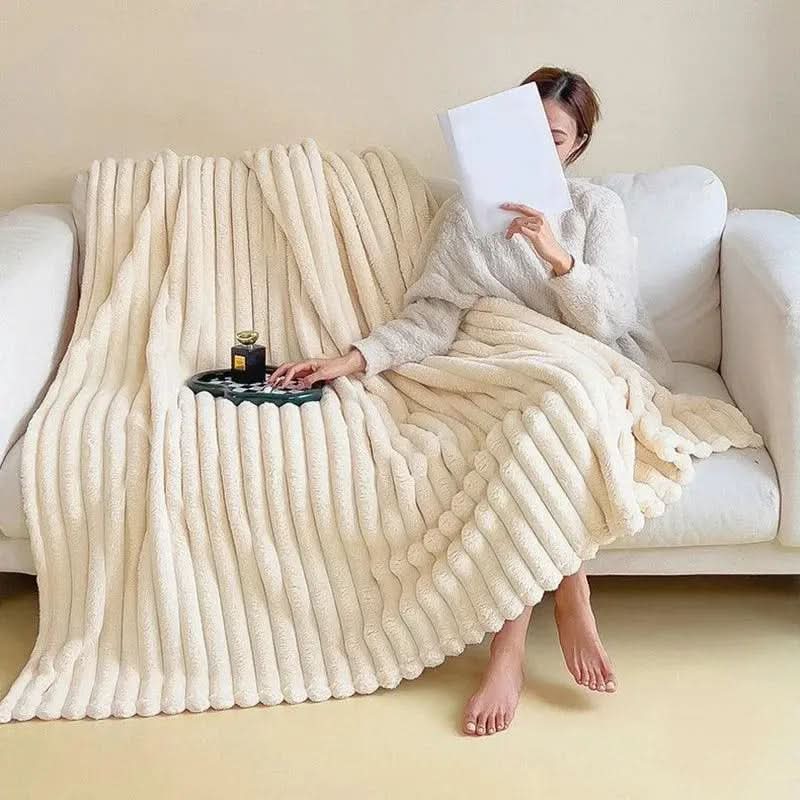 Strukturert plysjpledd for en koselig seng og sofa