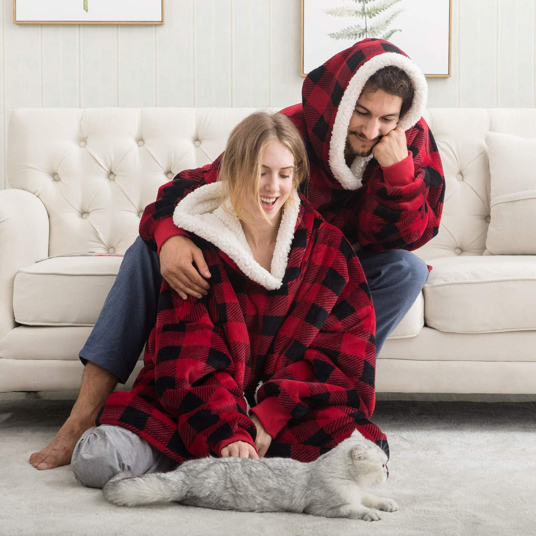 Pleddhettegenser i fleece med stor hette og lommer
