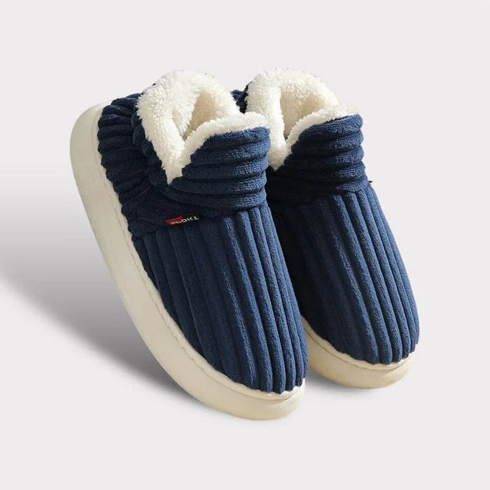 Myke tøfler i flanellfleece med sklisikker såle