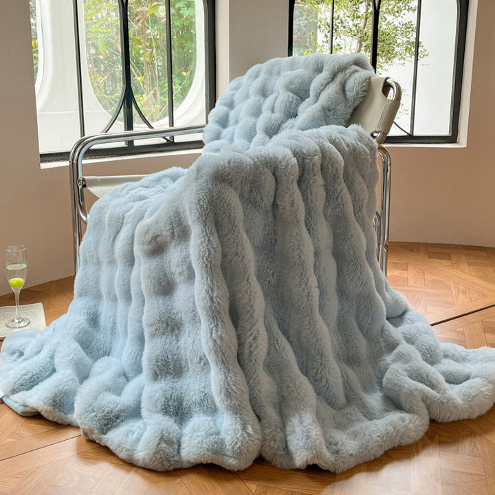 Mykt pledd med elegant bølgestruktur til sofa og seng