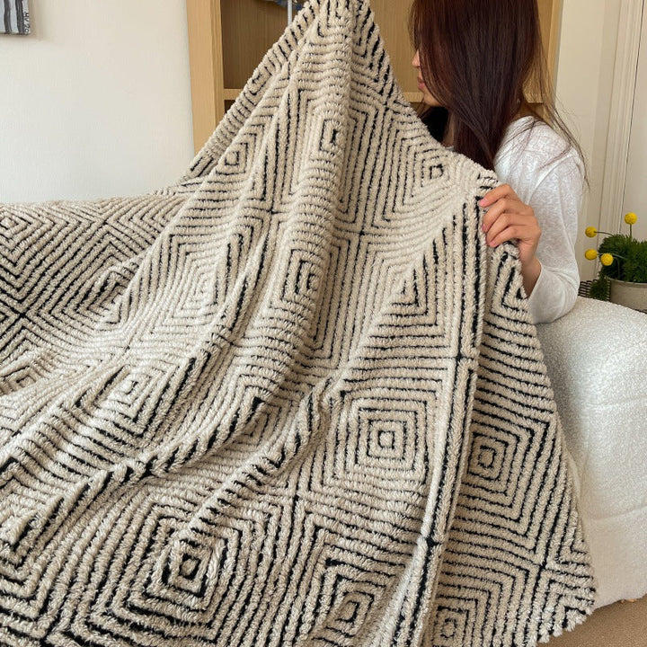 Myk pledd med geometrisk mønster til sofa og seng