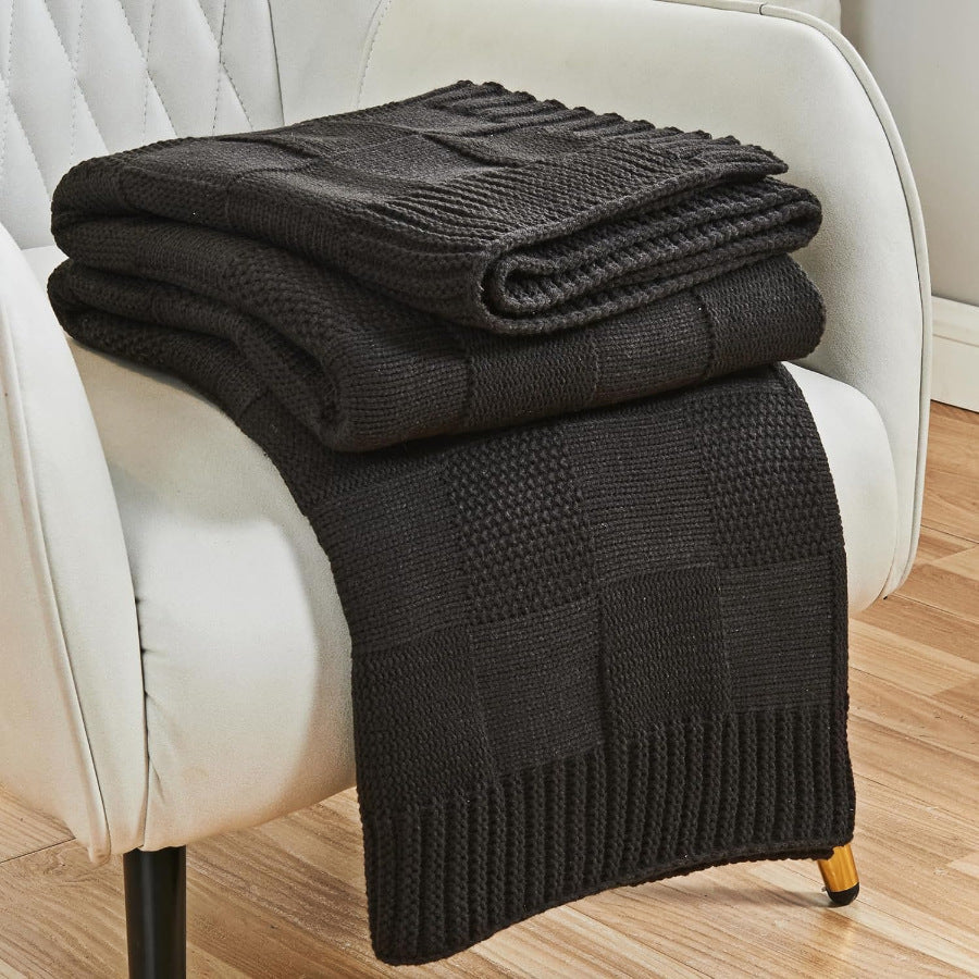 Strikket pledd med struktur, mykt og koselig i sofa og seng