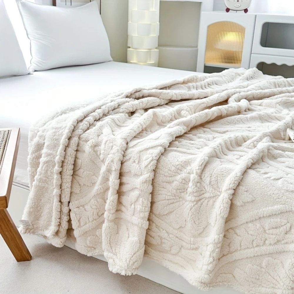 Fleecepledd i jacquard med geometrisk struktur i fire størrelser