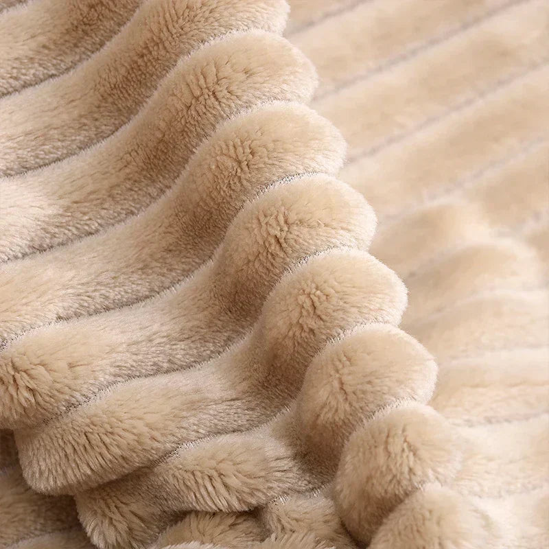 Luftig pledd i flanellfleece med riflet struktur