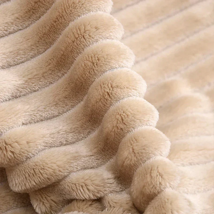 Luftig pledd i flanellfleece med riflet struktur