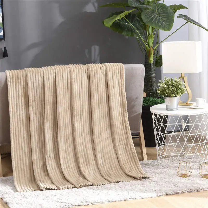 Luftig pledd i flanellfleece med riflet struktur