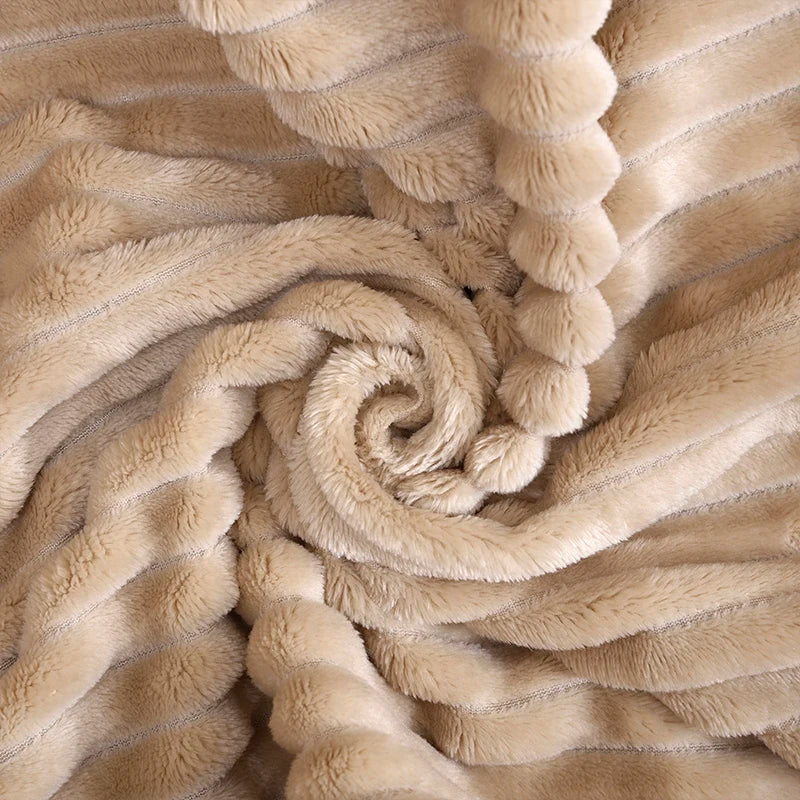 Luftig pledd i flanellfleece med riflet struktur