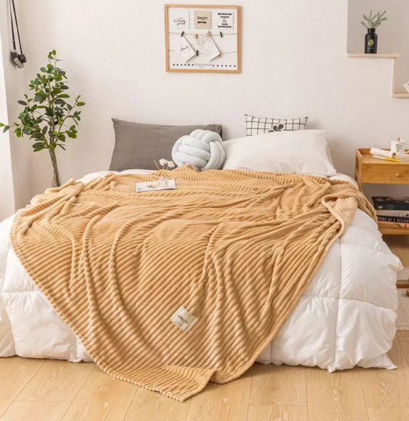 Myk flanellpledd som puster – varm pledd til sofa og seng