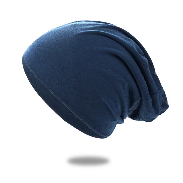 Slouch beanie i pustende strikk med stretch