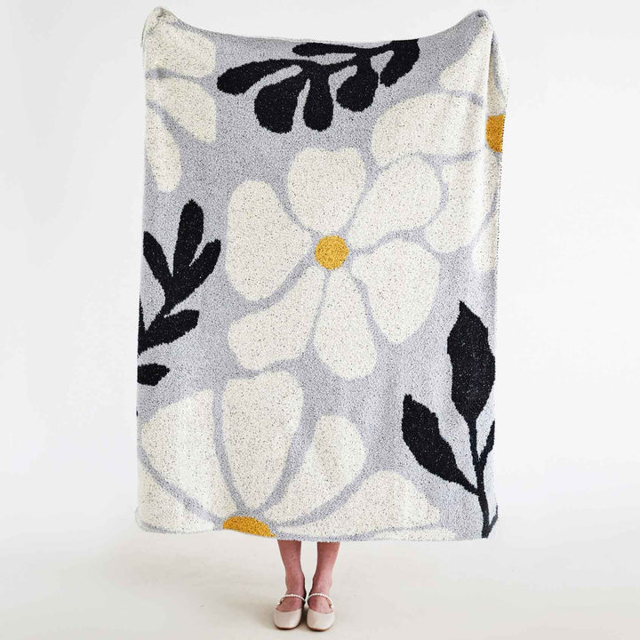 Strikket boho-pledd med blader og blomster i mikrofiber