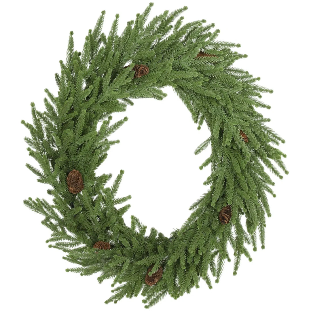Grønn julekrans med kongler på dør