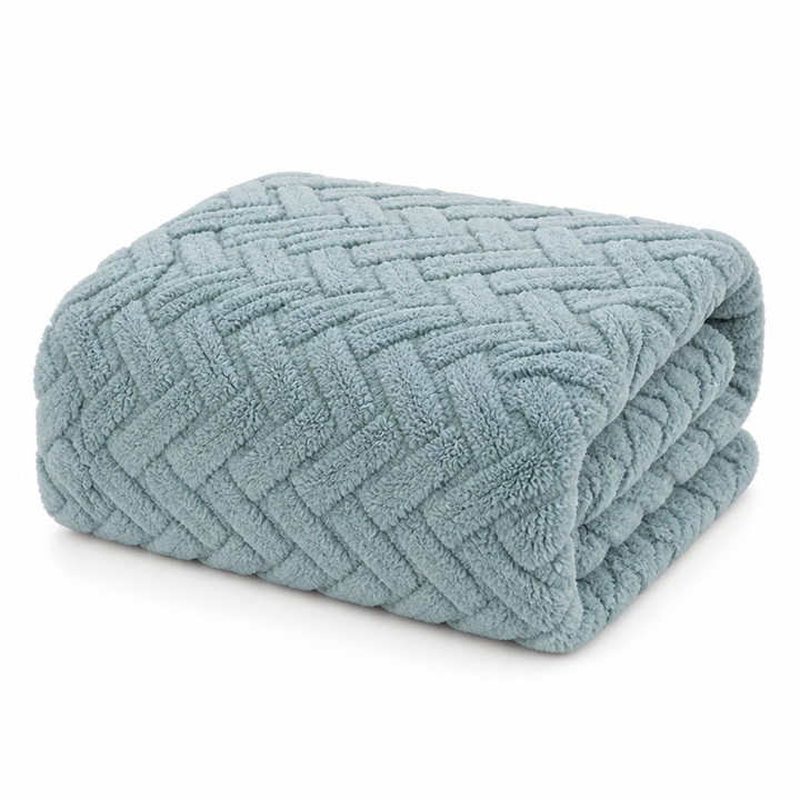 Vendbart fleecepledd i jacquard – én glatt og én myk side