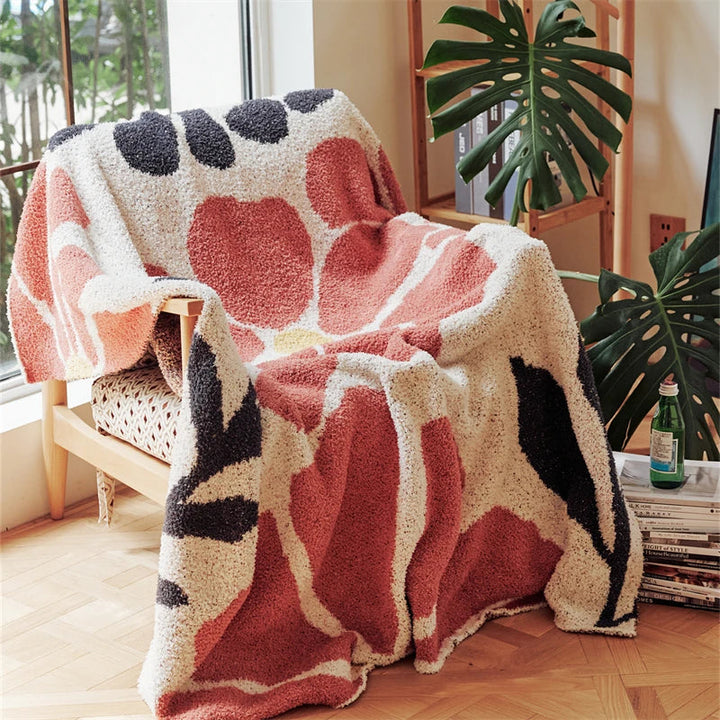 Strikket boho-pledd med blader og blomster i mikrofiber