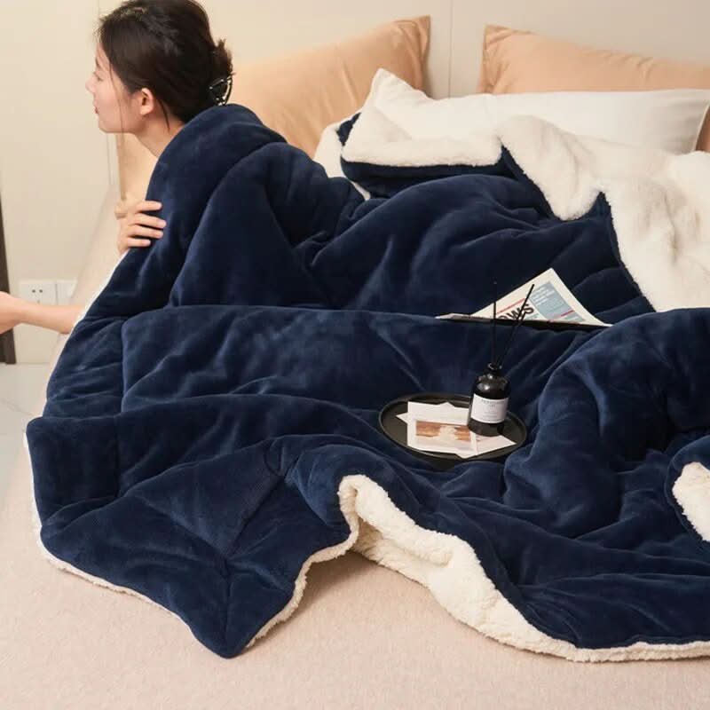 Vendbart sherpateppe i fleece til seng og sofa